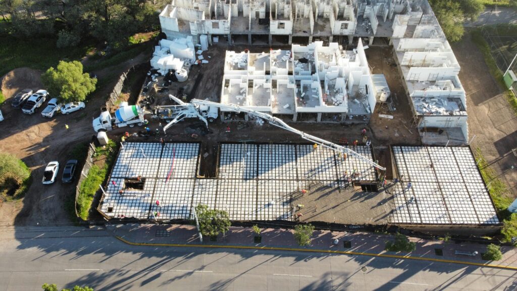 pexels photo 34017012 34017012 Aerial view of a construction site with foundation and building structures in progress in León, Mexico.